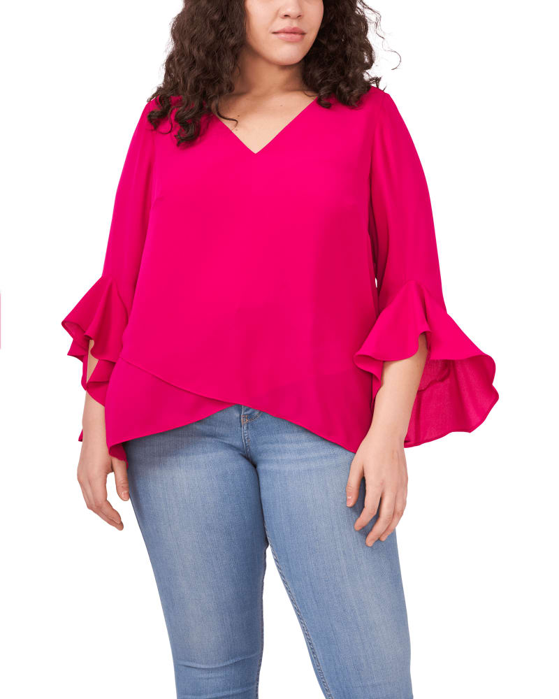 Front of a model wearing a size 1X Natalie Flutter Sleeve Tunic in FUCHSIA ROSE by Vince Camuto. | dia_product_style_image_id:261427